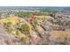 Expansive aerial view of the property surrounded by trees and neighborhood homes at 117 Roberts Rd, Summerville, SC 29483