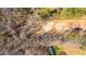Overhead aerial view of the tree covered property and cleared land in the rear of the property at 117 Roberts Rd, Summerville, SC 29483
