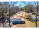Aerial view of the property showcasing cleared lot behind the home and surrounding trees at 117 Roberts Rd, Summerville, SC 29483