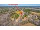 Expansive aerial view of 117 Roberts Rd surrounded by lush trees and greenery on a sunny day at 117 Roberts Rd, Summerville, SC 29483