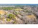 Real estate aerial view displays wooded area and the properties around it at 117 Roberts Rd, Summerville, SC 29483