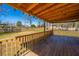 This cozy wooden back deck offers a great view of the backyard and fence, with a bright, sunny blue sky above at 117 Roberts Rd, Summerville, SC 29483