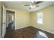 This spacious bedroom features a ceiling fan, wood-look floors, and a window that allows ample natural light at 117 Roberts Rd, Summerville, SC 29483