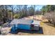 Charming blue home featuring a covered deck, porch, and natural surroundings at 117 Roberts Rd, Summerville, SC 29483