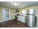 Kitchen features white cabinets, stainless appliances, and a modern countertop at 117 Roberts Rd, Summerville, SC 29483