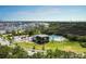 Scenic aerial view of community pool, The Crow's Nest, and surrounding neighborhood in a lush, green setting at 1225 Blakeway St # 1104, Daniel Island, SC 29492