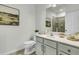 Bathroom featuring ample vanity space, a large mirror, soothing neutral paint, and a glass-door shower at 1225 Blakeway St # 1104, Daniel Island, SC 29492