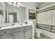 Bathroom featuring ample vanity space, a large mirror, soothing neutral paint, and a shower/tub combo at 1225 Blakeway St # 1104, Daniel Island, SC 29492