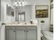 Bathroom featuring ample vanity space, a large mirror, and soothing neutral paint at 1225 Blakeway St # 1104, Daniel Island, SC 29492