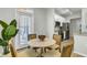 Bright dining area near the kitchen featuring a round table with seating for four at 1225 Blakeway St # 1104, Daniel Island, SC 29492