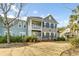 Charming multi-level condo with a well-maintained lawn and landscaping at 1225 Blakeway St # 1104, Daniel Island, SC 29492