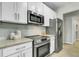 Contemporary kitchen with stainless steel appliances, subway tile backsplash and granite countertops at 1225 Blakeway St # 1104, Daniel Island, SC 29492