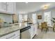 Modern kitchen island featuring stainless steel appliances, granite countertops, and ample storage at 1225 Blakeway St # 1104, Daniel Island, SC 29492
