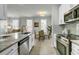 Open kitchen area with sleek stainless steel appliances, and a spacious breakfast bar at 1225 Blakeway St # 1104, Daniel Island, SC 29492
