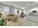 Bright living area with an open floorplan, seamlessly connecting to a dining area and modern kitchen at 1225 Blakeway St # 1104, Daniel Island, SC 29492
