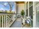 Comfortable porch featuring two cushioned chairs and a small table at 1225 Blakeway St # 1104, Daniel Island, SC 29492