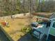 Aerial view of a large, fenced backyard featuring a patio, hot tub, swing, and outdoor seating at 136 Stagecoach Ln, Summerville, SC 29483