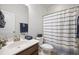 Cozy bathroom with a shower, white vanity, decorative mirror, and stylish navy blue accents at 136 Stagecoach Ln, Summerville, SC 29483