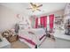 This room features red curtains, a bed, and personal touches at 136 Stagecoach Ln, Summerville, SC 29483
