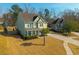 Charming two-story home with green siding, well-manicured lawn, and ample parking at 136 Stagecoach Ln, Summerville, SC 29483