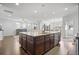 Bright open kitchen with a large granite island, stainless steel appliances, and modern fixtures at 136 Stagecoach Ln, Summerville, SC 29483