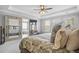 A beautifully designed main bedroom features tray ceilings, a ceiling fan, and a TV at 136 Stagecoach Ln, Summerville, SC 29483