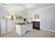 Bright home office with a fireplace, spacious desk, white cabinets, and decorative accents at 136 Stagecoach Ln, Summerville, SC 29483
