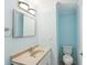 Well-lit bathroom featuring a modern sink, faucet, toilet, and mirror above the sink at 1491 Seacroft Rd, James Island, SC 29412