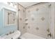 Bathroom featuring shower-tub combo with decorative tiled walls and a stylish vanity at 1491 Seacroft Rd, James Island, SC 29412