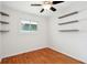 Cozy bedroom showcasing natural light and custom floating shelves at 1491 Seacroft Rd, James Island, SC 29412