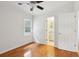 Bright bedroom with hardwood floors, ensuite bathroom, and window at 1491 Seacroft Rd, James Island, SC 29412