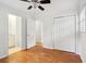 Bright bedroom with hardwood floors, ensuite bathroom, and closet at 1491 Seacroft Rd, James Island, SC 29412
