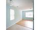 Spacious living room with beautiful light blue paint and a mix of tiled and wood flooring at 1491 Seacroft Rd, James Island, SC 29412
