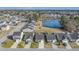 Scenic aerial view of a residential community with a central pond, showcasing well-maintained homes and landscaping at 152 Coosawatchie St, Summerville, SC 29485