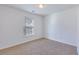 Neutral bedroom with plush carpeting, a bright window, and crisp white walls at 152 Coosawatchie St, Summerville, SC 29485