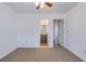 Bright bedroom with carpeted floors and convenient access to the bathroom and additional living space at 152 Coosawatchie St, Summerville, SC 29485