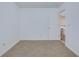 Cozy bedroom featuring neutral carpet, white walls, and an open doorway at 152 Coosawatchie St, Summerville, SC 29485