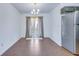 Cozy dining room with elegant chandelier, tile floors, and easy access to the kitchen and outdoor area at 152 Coosawatchie St, Summerville, SC 29485