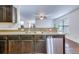 Functional kitchen with stainless steel appliances, dark cabinets, and open layout into the living area at 152 Coosawatchie St, Summerville, SC 29485