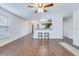 Bright living room featuring beautiful flooring, a ceiling fan, and easy access to the kitchen at 152 Coosawatchie St, Summerville, SC 29485