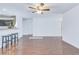 Spacious living room with modern flooring, a ceiling fan, and an open layout to the kitchen at 152 Coosawatchie St, Summerville, SC 29485
