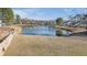 Picturesque pond view surrounded by lush greenery and neighboring homes in a quiet community at 152 Coosawatchie St, Summerville, SC 29485
