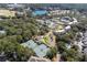 Aerial view showcasing tennis courts and pond near condo and home community at 2012 Long Bend Drive, Seabrook Island, SC 29455