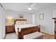 Comfortable bedroom with ceiling fan, wood floors, and neutral paint at 2012 Long Bend Drive, Seabrook Island, SC 29455
