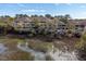Exterior view of a condo building with balconies, situated along the marsh at 2012 Long Bend Drive, Seabrook Island, SC 29455