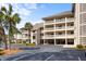 Spacious condo complex featuring multi-story buildings with private balconies and ample parking at 2012 Long Bend Drive, Seabrook Island, SC 29455