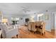 Bright and airy living room with hardwood floors, comfortable seating, and dining area at 2012 Long Bend Drive, Seabrook Island, SC 29455