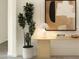 Elegant entryway featuring a console table, a decorative lamp, an attractive painting and a potted tree at 2026 Mcguire Ln # 007, Hollywood, SC 29449