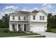 Charming two story home with a covered front porch, attached two car garage, and manicured lawn at 2026 Mcguire Ln # 007, Hollywood, SC 29449