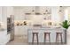 Bright white kitchen with stainless steel appliances, hardwood floors, and lots of natural light at 2026 Mcguire Ln # 007, Hollywood, SC 29449